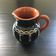 Midnight blue pitcher with ivory decor