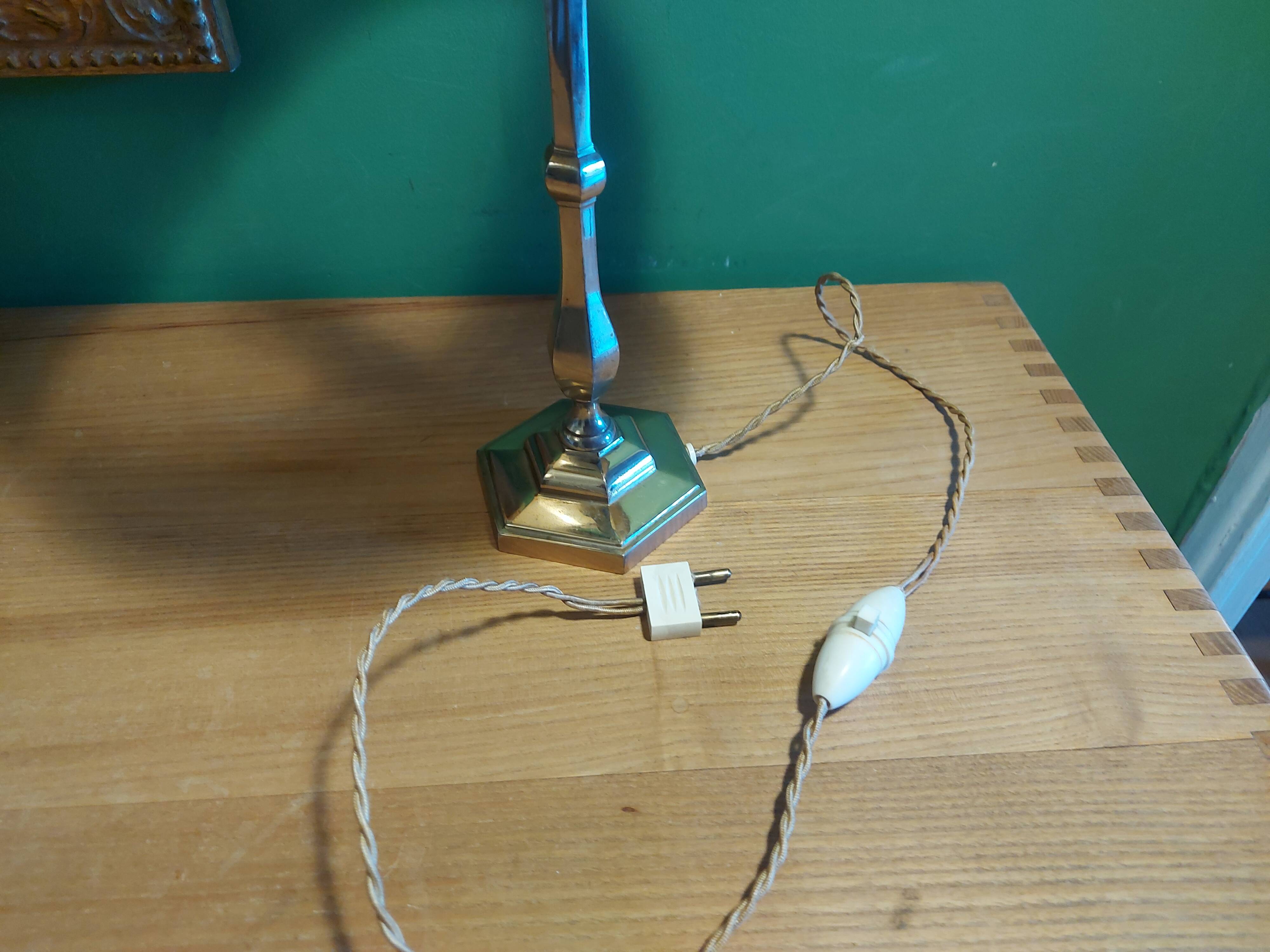 Silver metal lamp with its lampshade