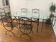 Table and chair set made of solid wrought iron metal.
