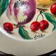 Faience plate in Longwy enamels signed Léa Valentin Les Fruits