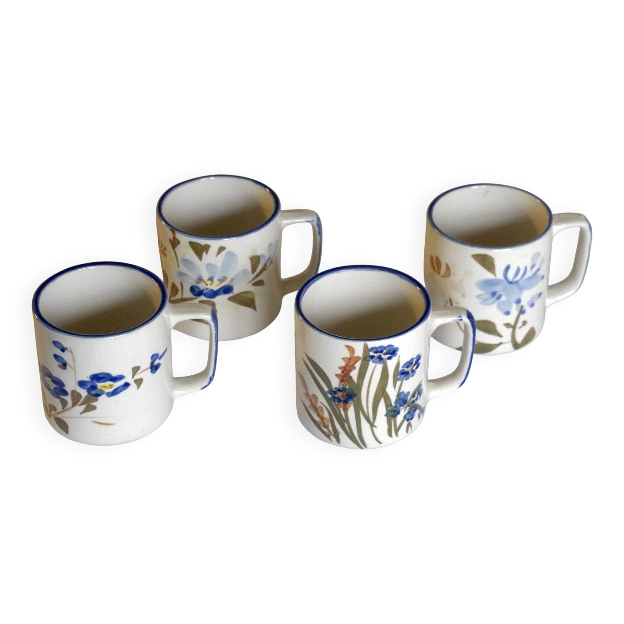 Set of 4 stoneware cups/mugs with blue floral designs, made in China.