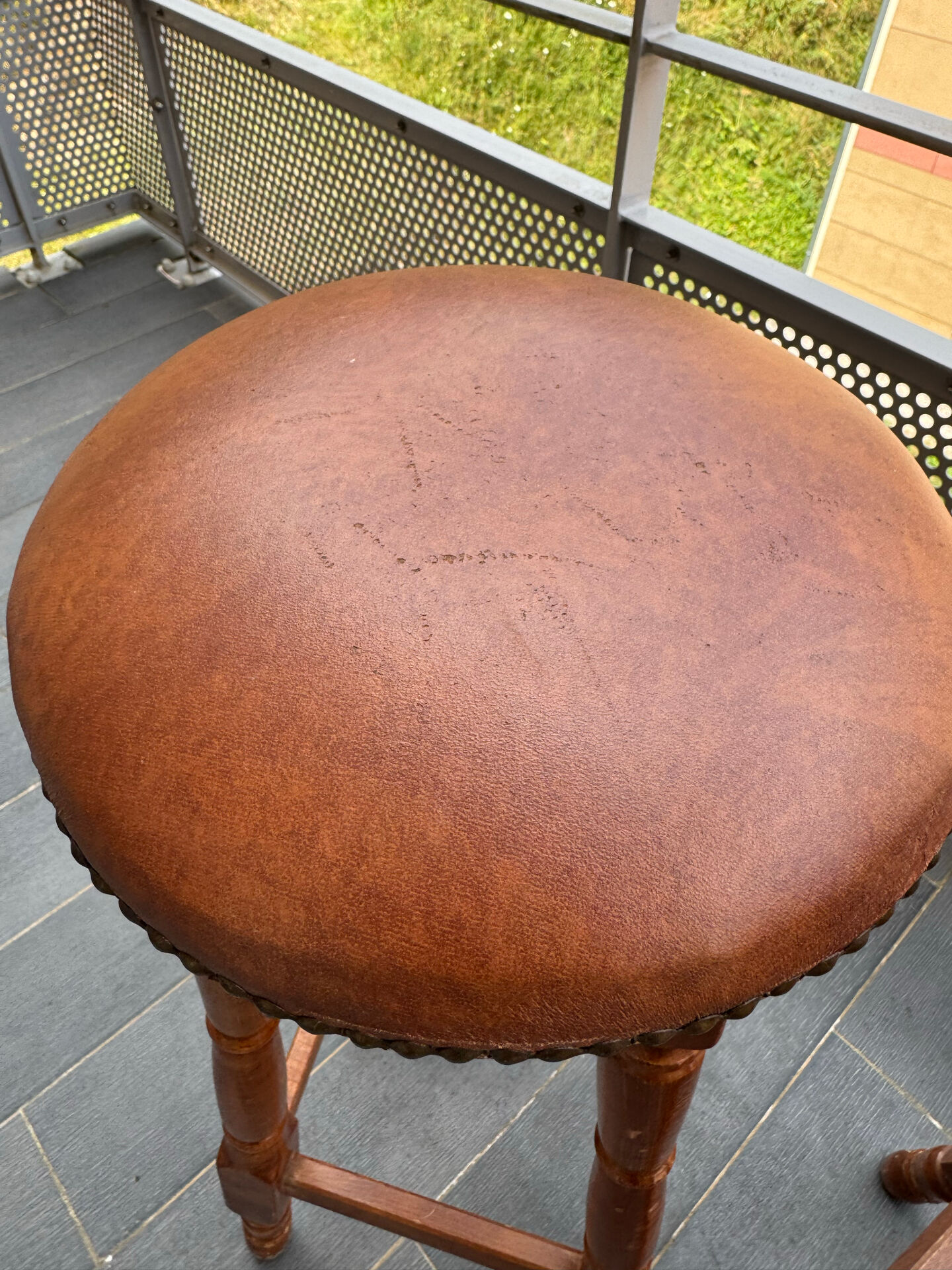 pair of vintage wooden and leather bar stools