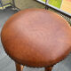 pair of vintage wooden and leather bar stools