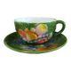 Antique cup and saucer in slipware.