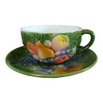 Antique cup and saucer in slipware.