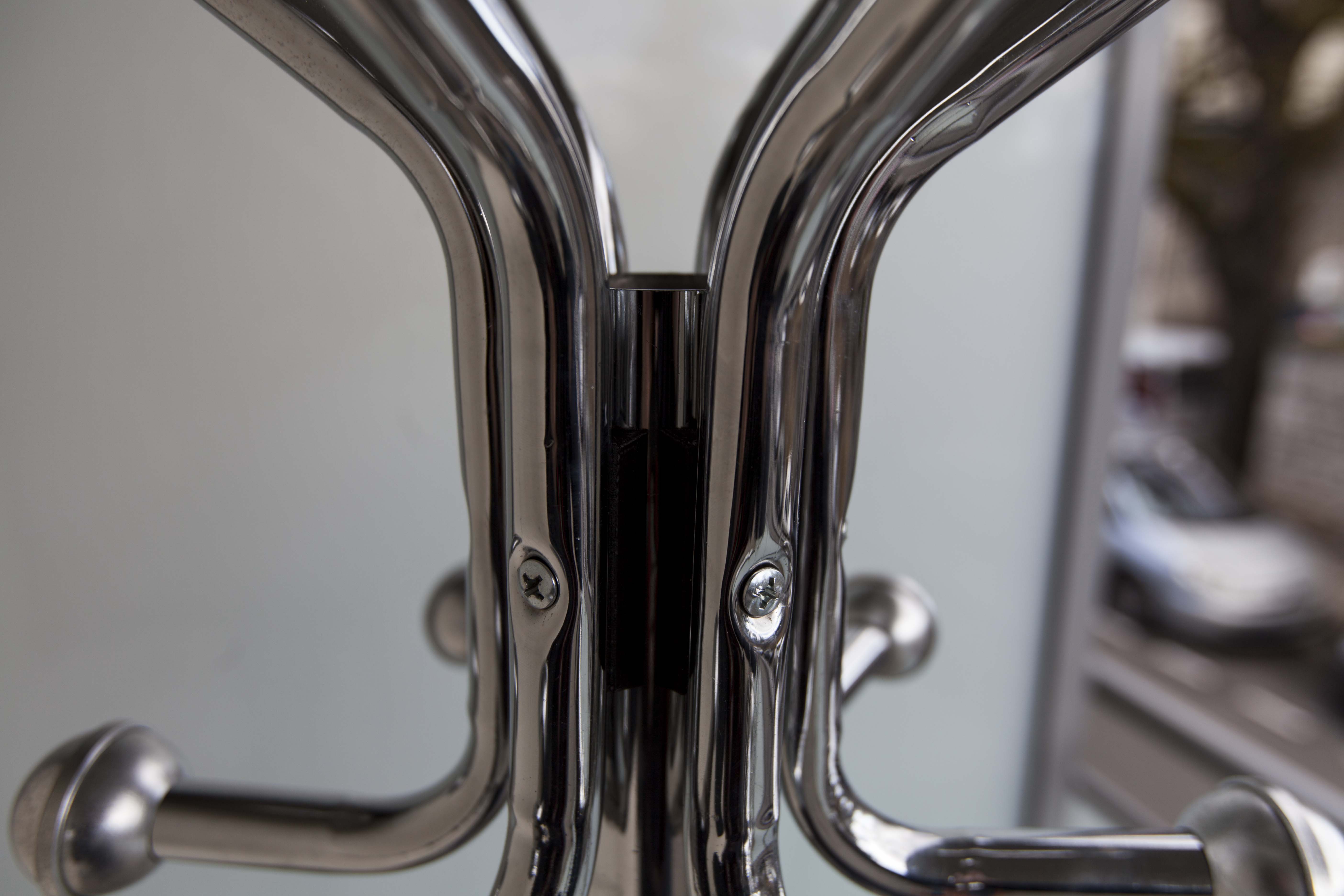 Chrome metal parrot coat holder from the 70s