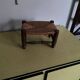 Turned wooden stool and straw