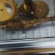 Pair of neoclassical candle holders in gilded bronze and green onyx, bust of