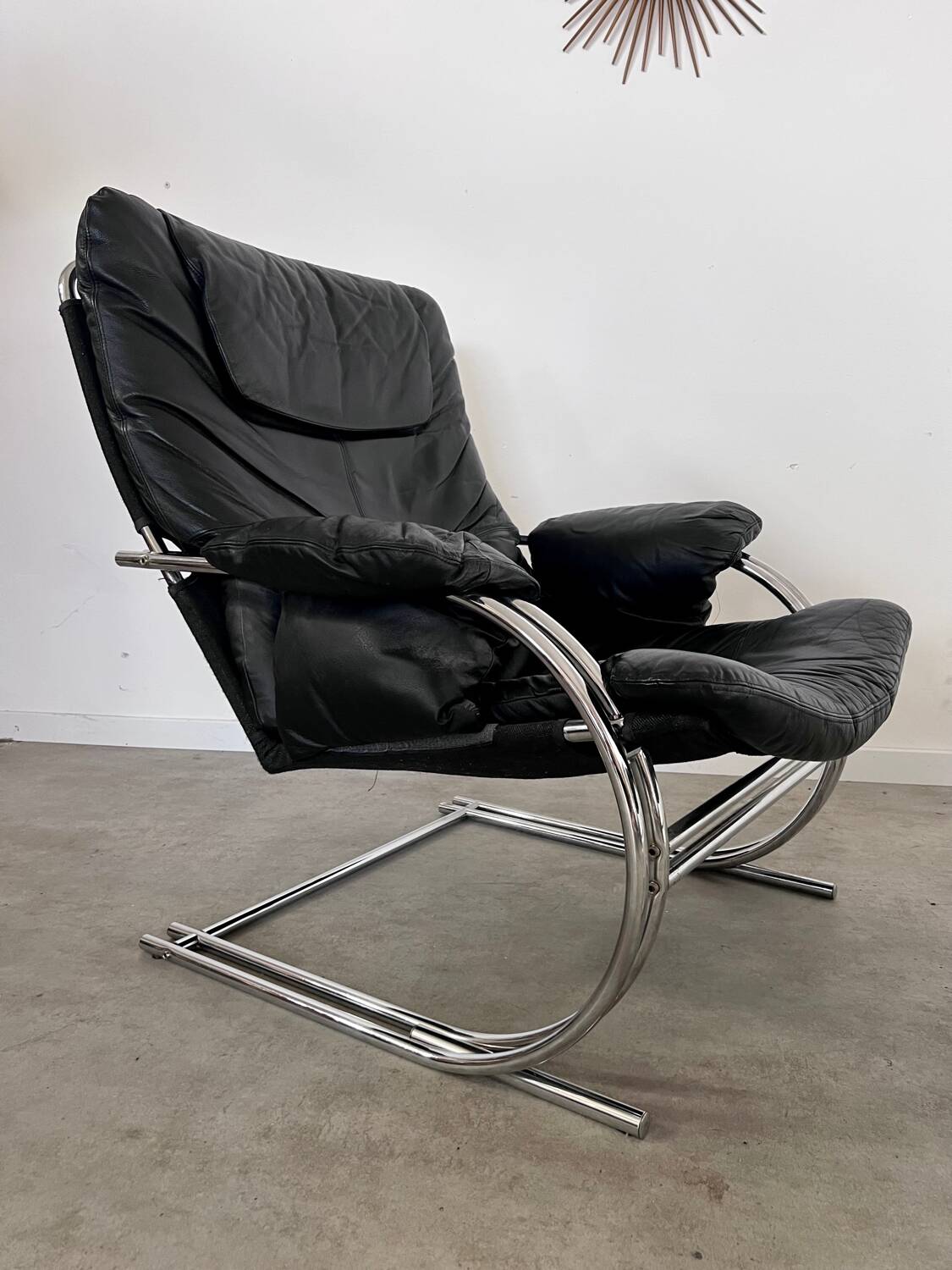 Old armchair and ottoman black leather tubular chrome bauhaus design from the 70s