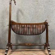 Empire style mahogany cradle with a swan neck, shaped like a cradle, circa 1810