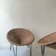 Italian basket chair in rattan and black metal, 1950s design.