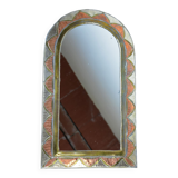 Decorated brass mirror.