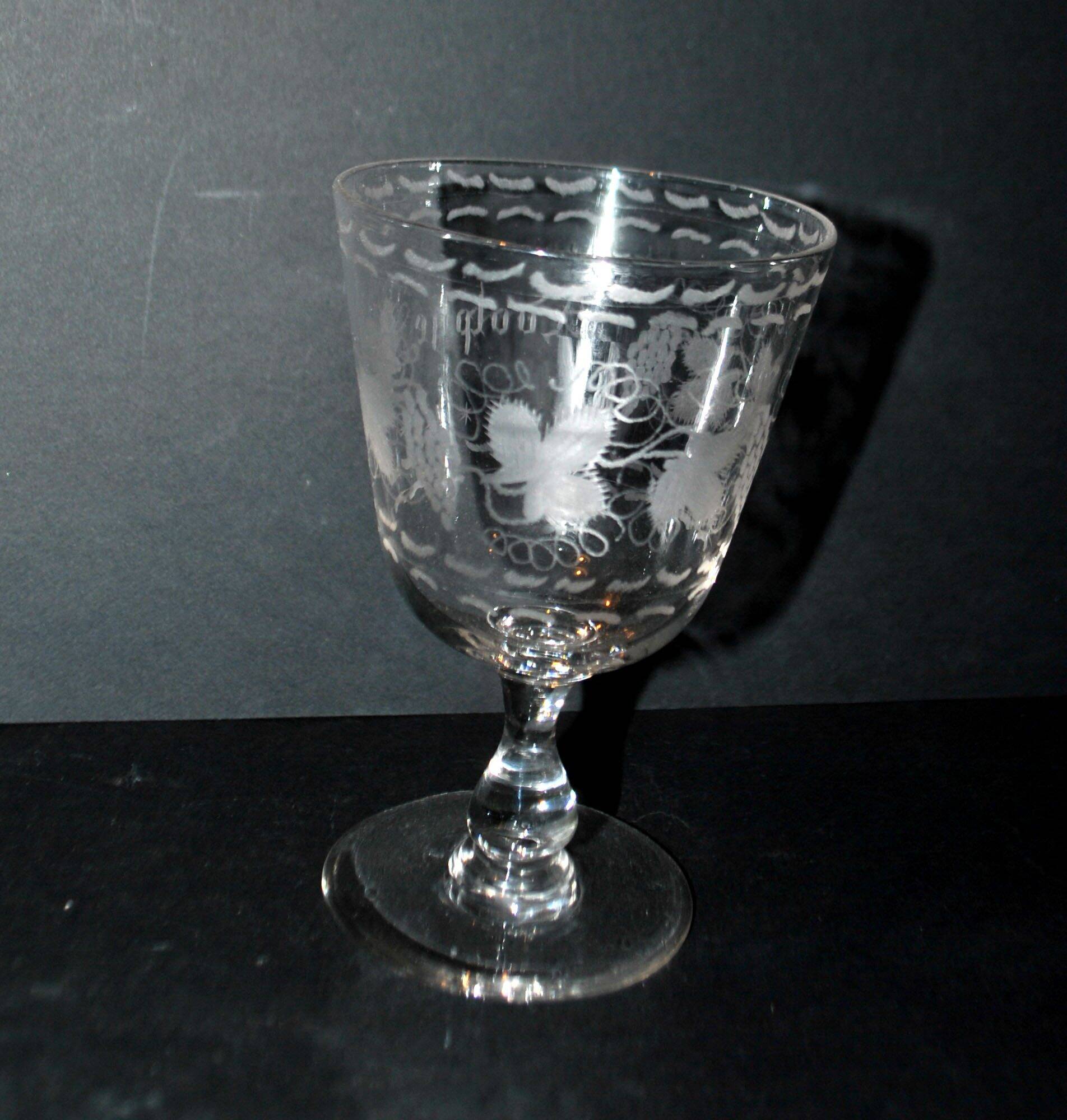 Antique souvenir glass tumbler engraved with the name Adolphe