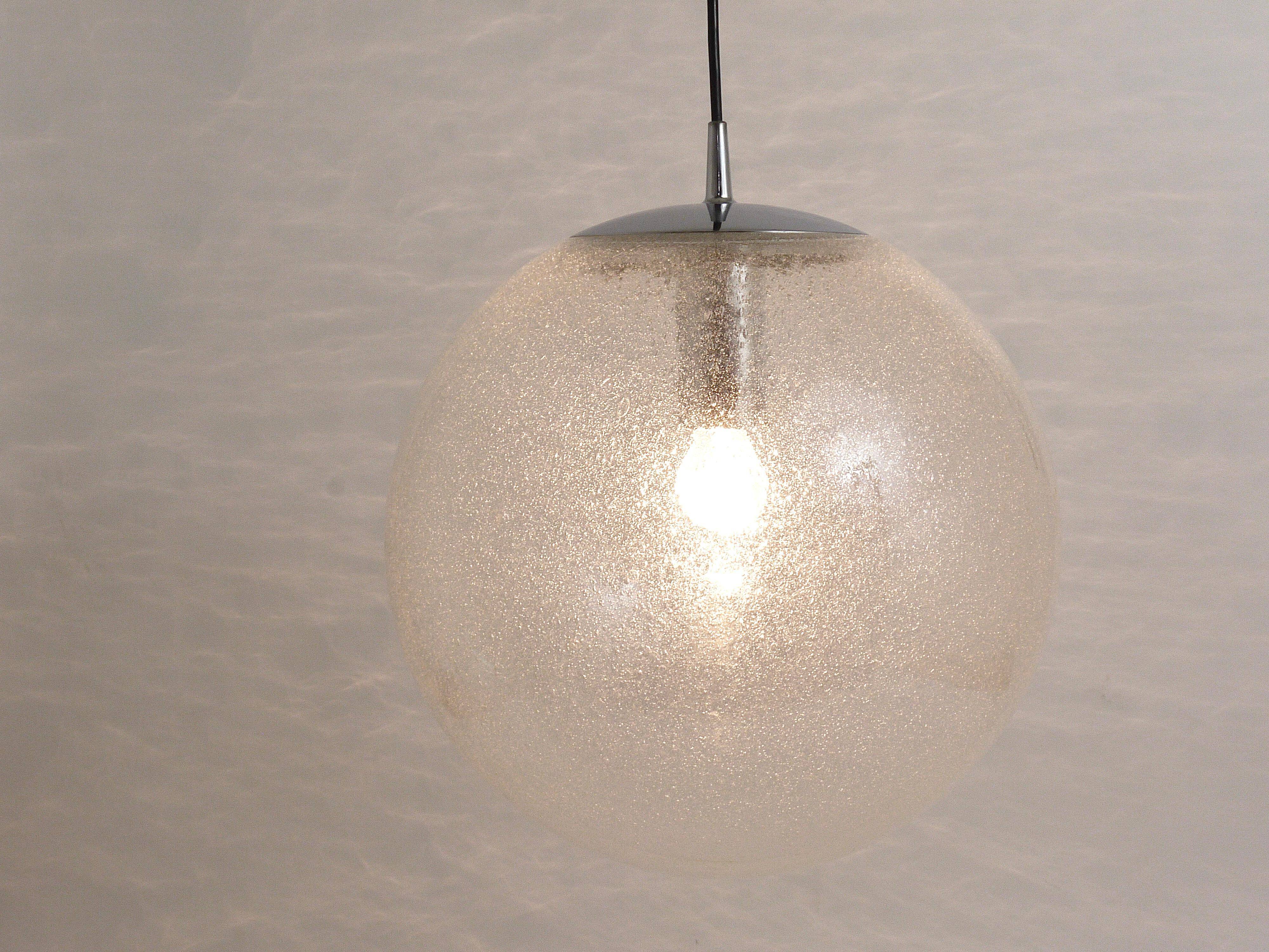Large glass globe pendant light with bubbles and chrome by Peil & Putzler, Germany, 1970s.