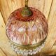 Antique pink glass pendant light with tassels.