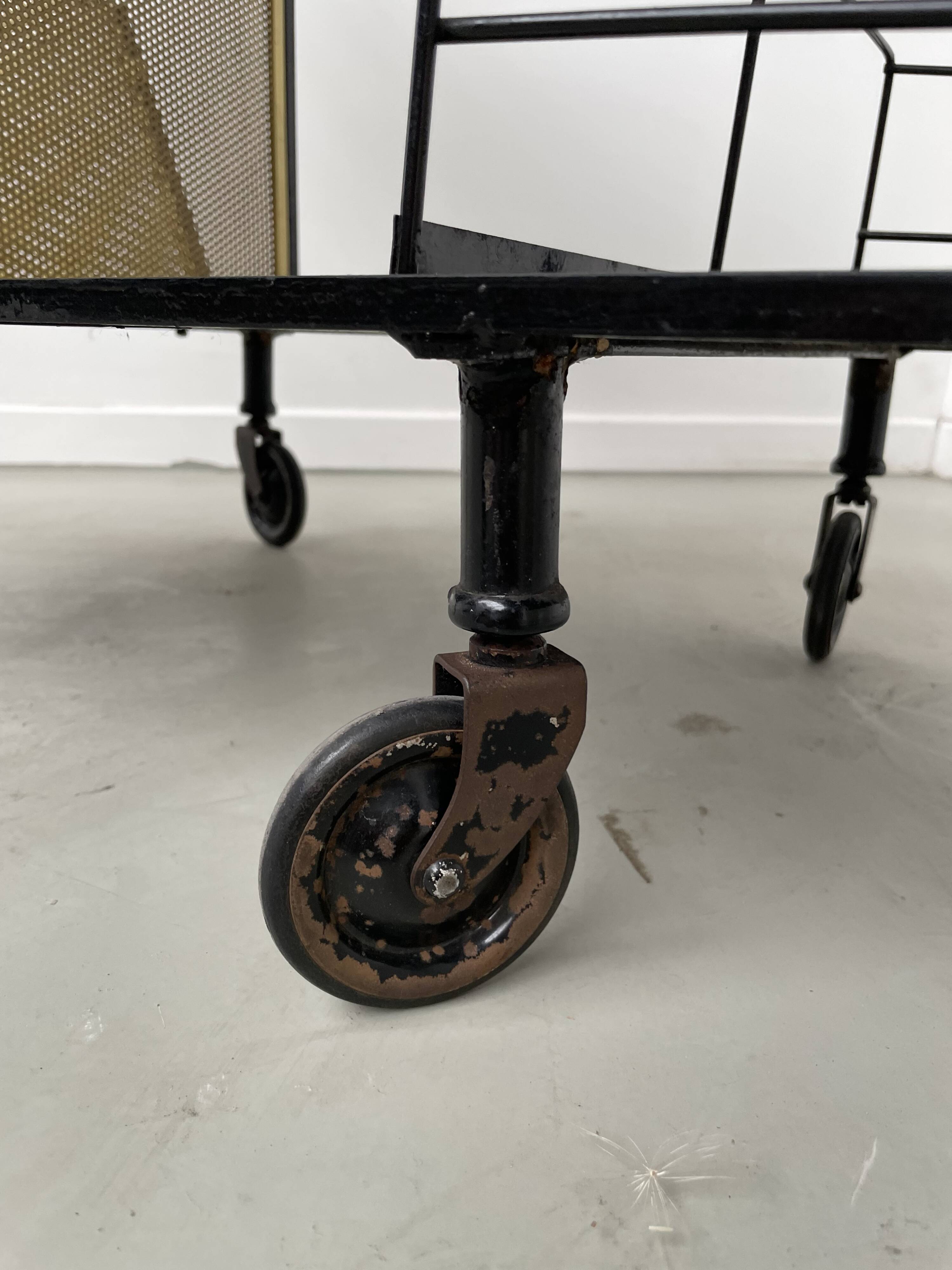 Perforated metal serving trolley in the Mathieu Matégot style