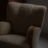 Pair of Danish Art Deco modern lounge chairs in sheepskin with lambswool and elm, 1940s.