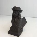 Pair of cast iron andirons in the likeness of a musketeer