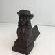 Pair of cast iron andirons in the likeness of a musketeer