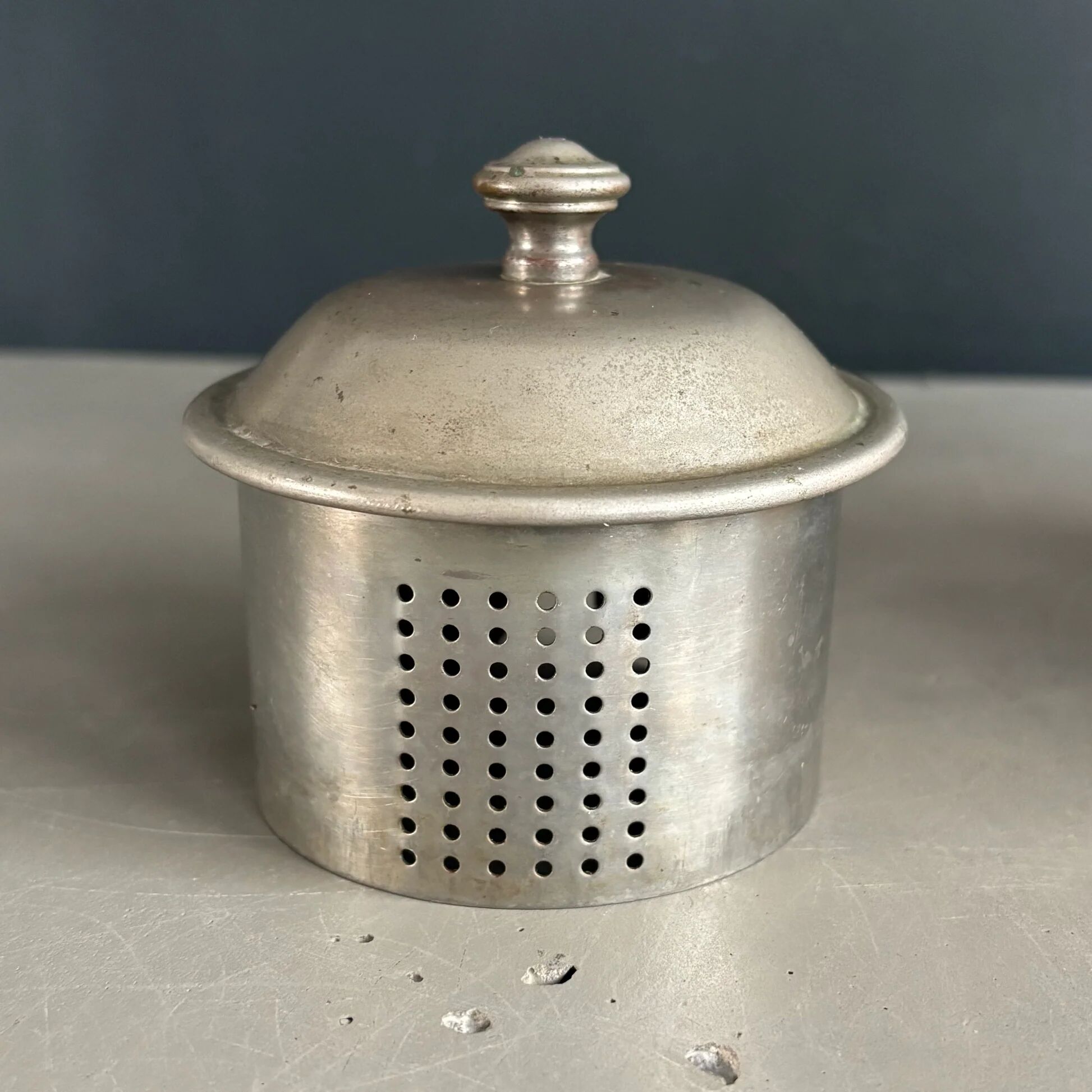 Antique teapot in earthenware with a tin filter lid.