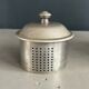 Antique teapot in earthenware with a tin filter lid.