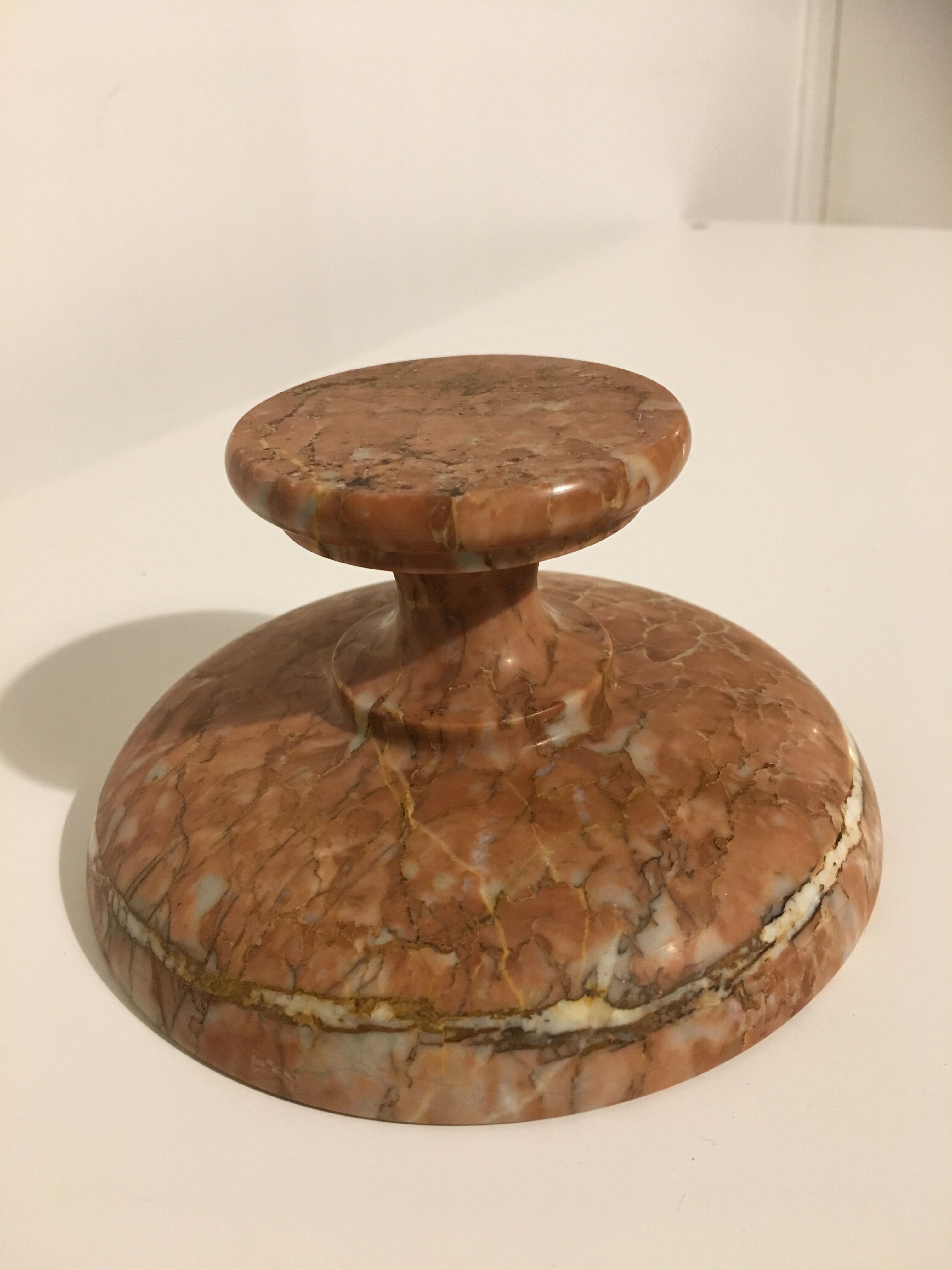 Empty pocket on foot in red marble