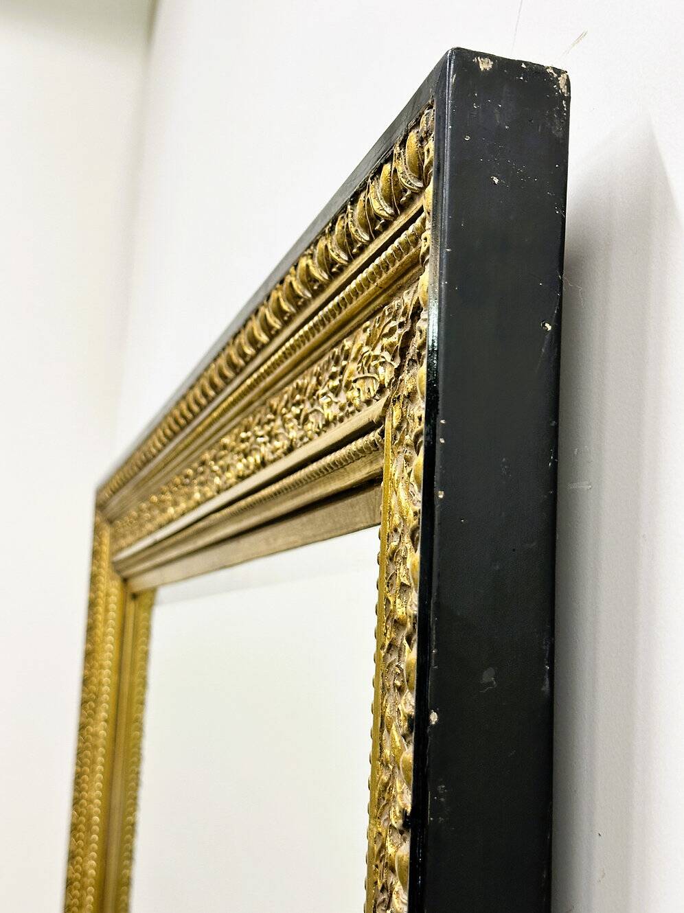 Vintage rectangular classical gold and black mirror. France, 1970s.
