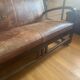 Vintage colonial-style bench in solid wood and patinated leather.