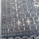 Vintage hand knotted rug with geometric patterns on a grey/beige/terracotta background 170 x 96 cm