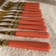 Set of 12 coral and gold dessert forks