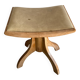 Vintage natural wood stool with light yellow faux leather seat and crossed splayed base