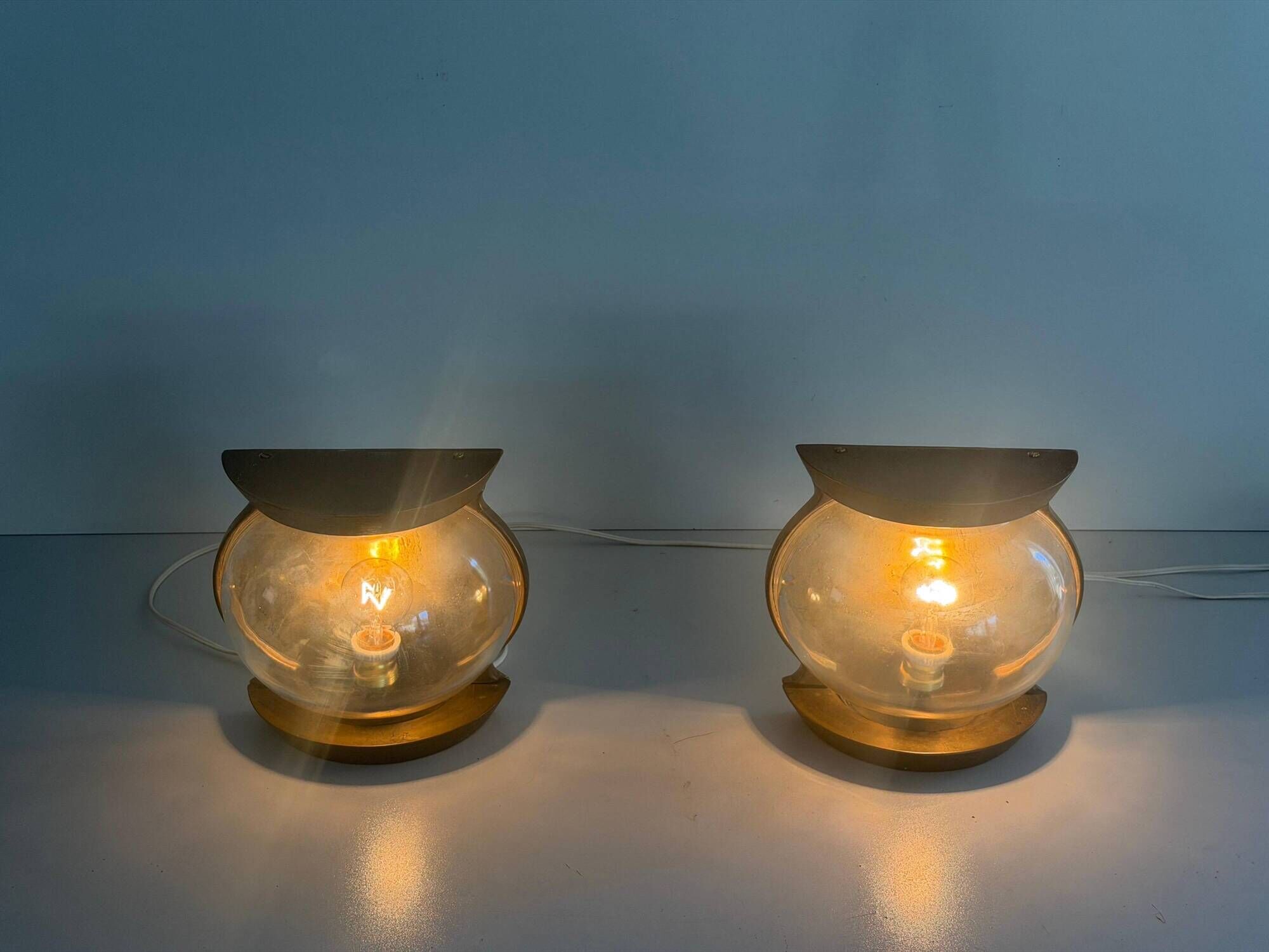 Pair of bronze and glass wall lights from the mid-century, 1960, Italy.