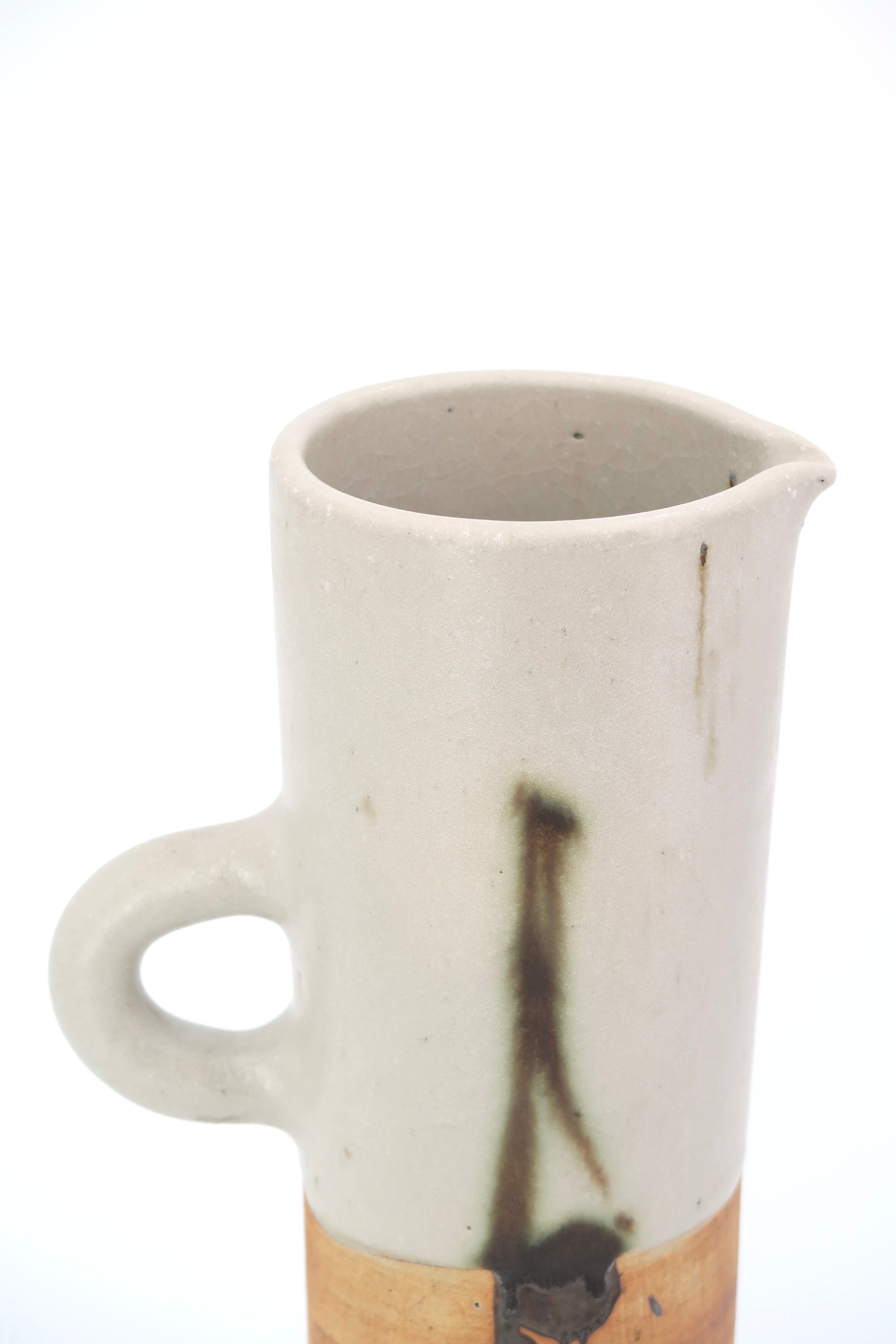 Two ceramic pitchers from the Dove pottery