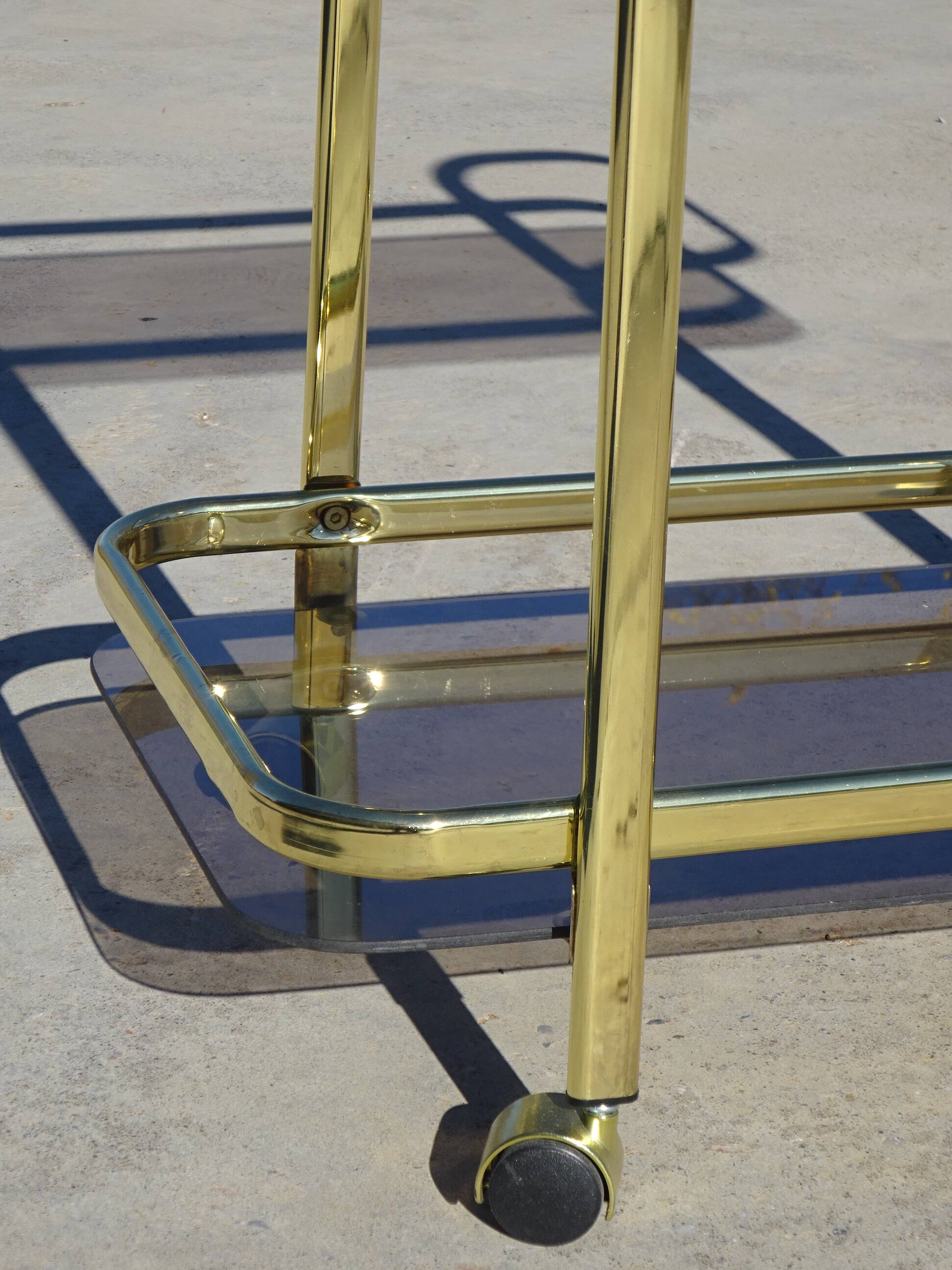 Golden metal and smoked glass dessert table