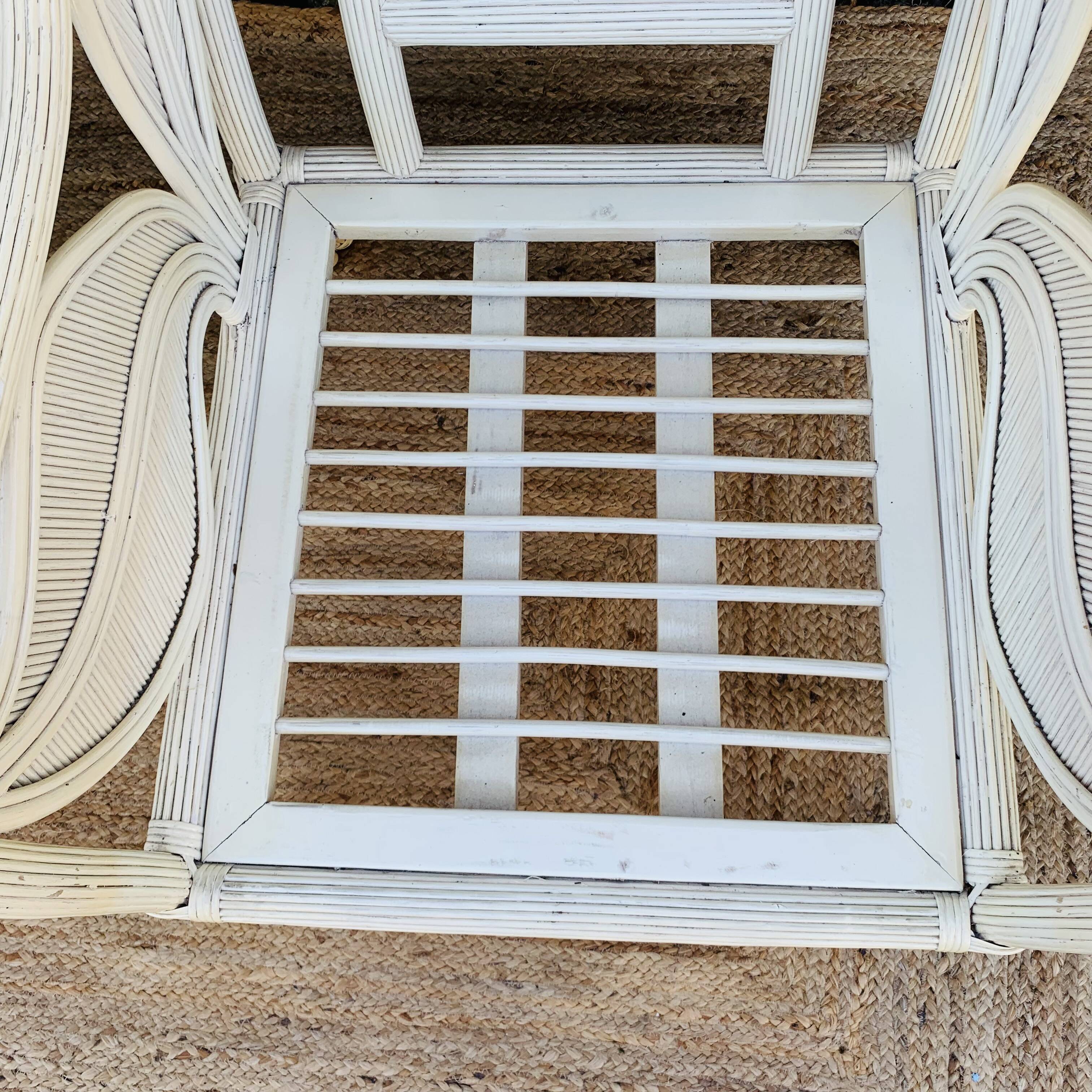 Pair of white rattan armchairs