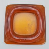 Empty-pocket in amber glass