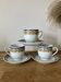 Set of 3 blue and yellow ceramic coffee cups and saucers