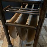 Vintage rattan magazine rack on wheels