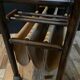 Vintage rattan magazine rack on wheels