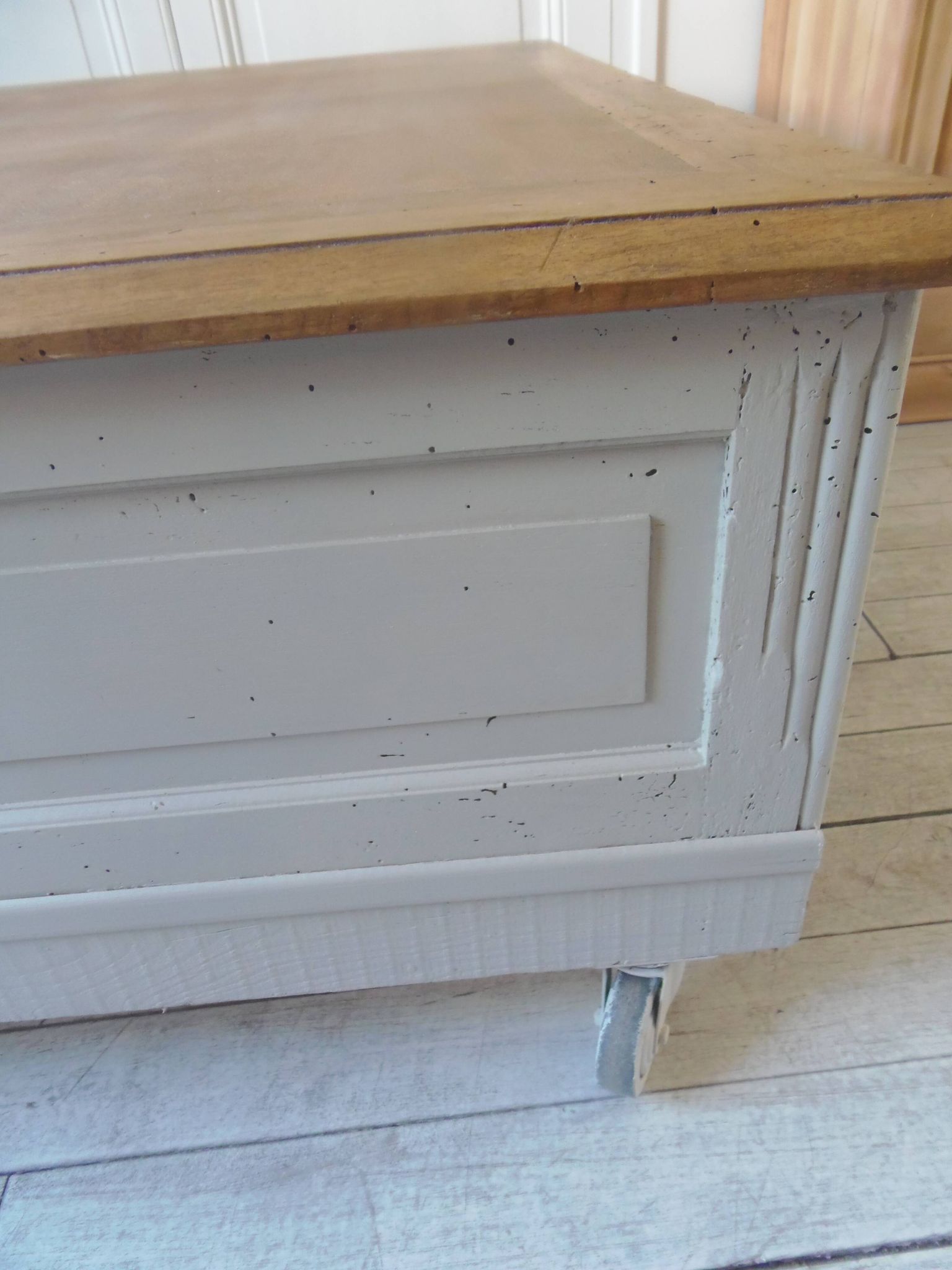 Coffee table on casters, made from an old desk, pearl gray base and belt.