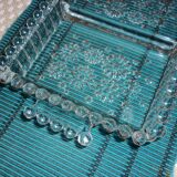 Antique dish in chiseled glass with pearls