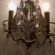 Pair of mirror sconces with two arms of light with gilded brass grapevines, Italy 1960.