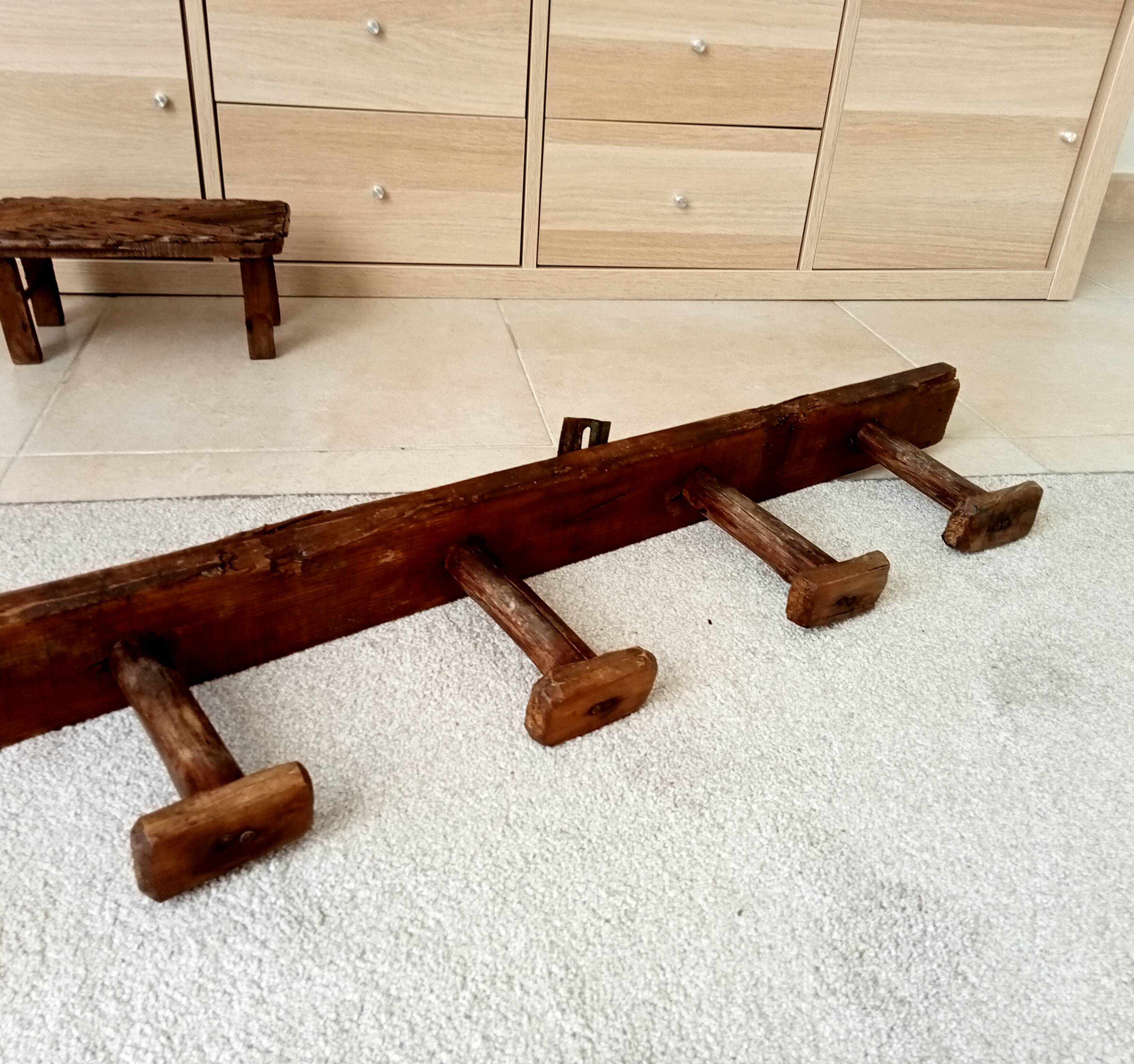 Old wall-mounted coat rack from a stable, folk art.