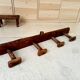Old wall-mounted coat rack from a stable, folk art.