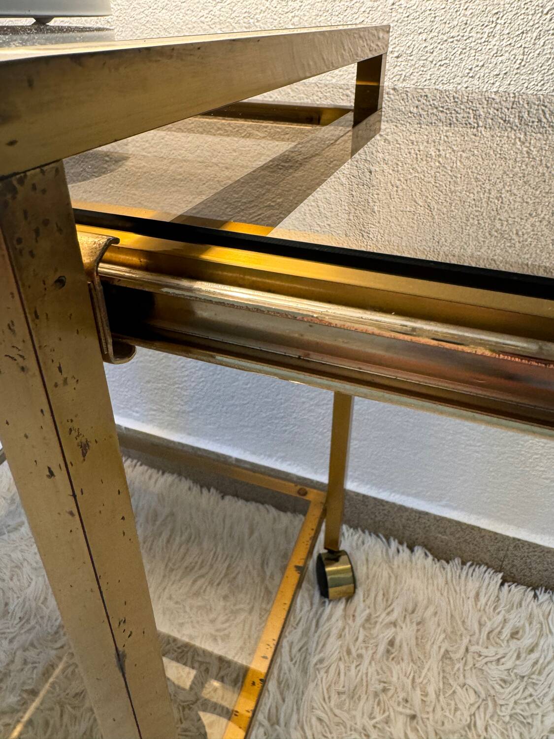 Brass rolling trolley with smoked glass from the 70s
