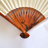 Vintage bamboo fan with floral decoration from China.