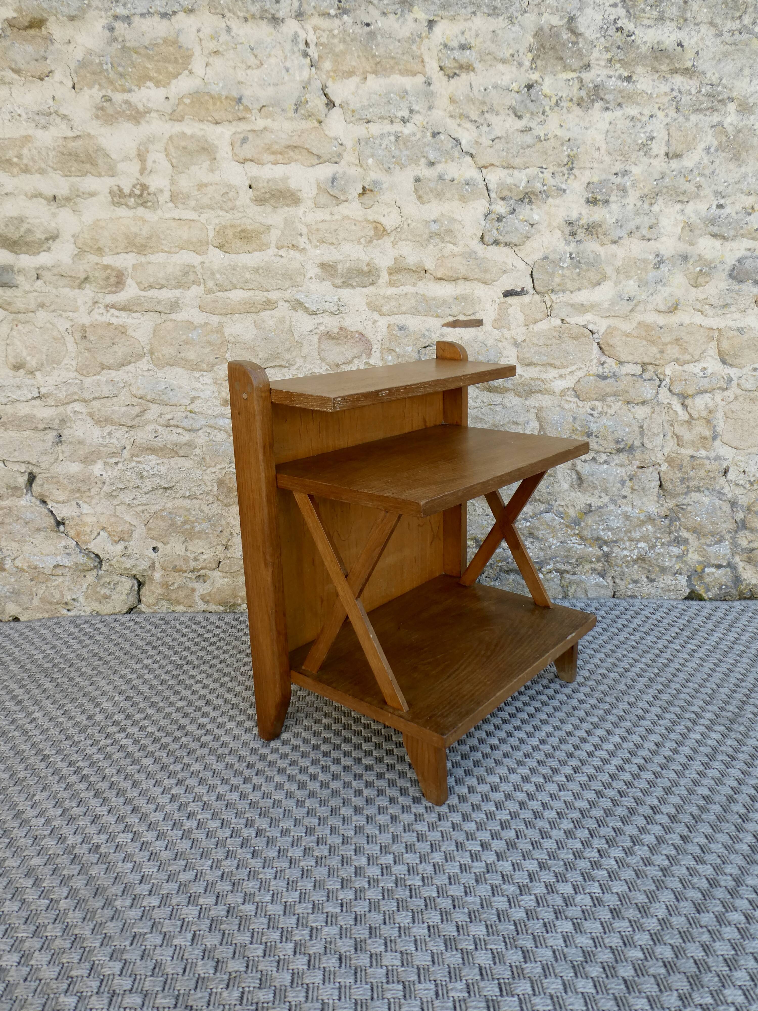 Light wood bedside table with crossbars and 3 shelves, around 1950.