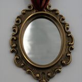 Vintage oval wall-mounted brass mirror