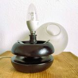 Small black wooden table lamp with frosted glass globe