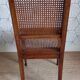 Art Deco caned chair with bronze ornaments.